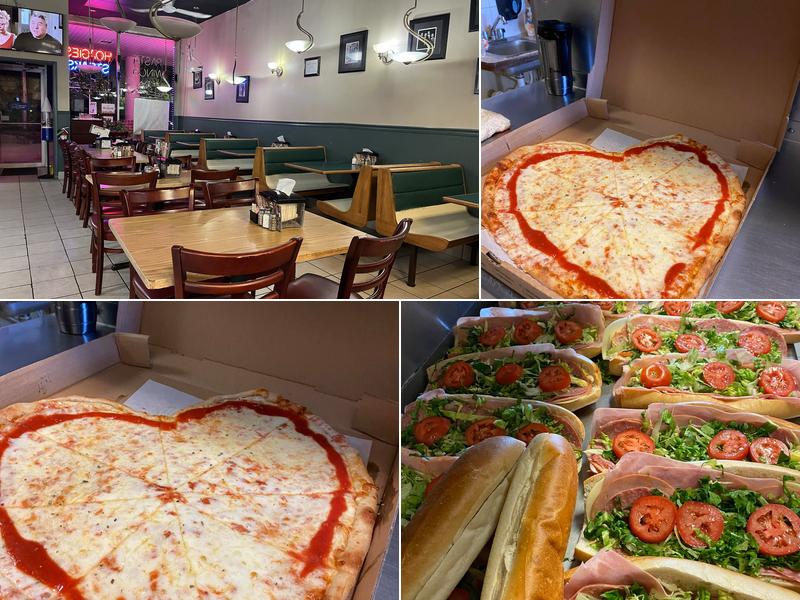 Tables, green booths and window neon inside Harleysville Pizzeria